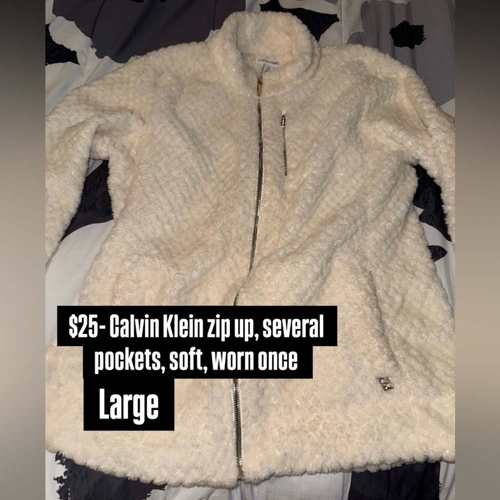 Calvin Klein, zip up. Several pockets, worn once, large